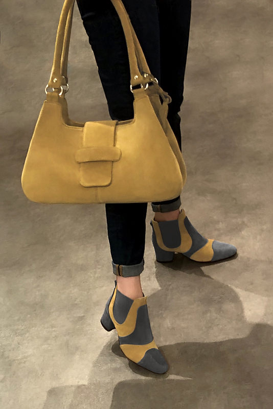 Dark grey and mustard yellow women's ankle boots, with elastics. Round toe. Low flare heels. Worn view - Florence KOOIJMAN